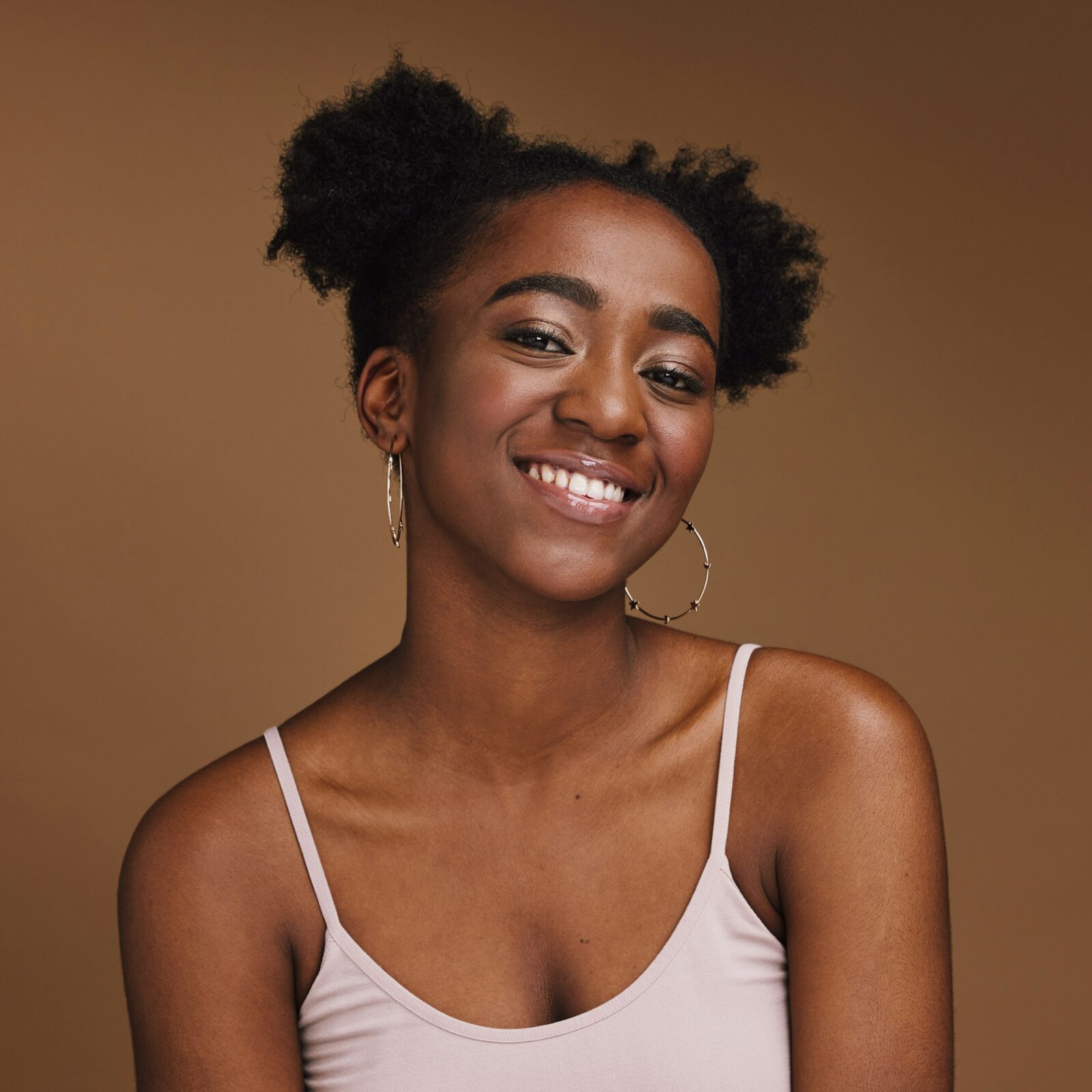 black-woman-smile-and-student-portrait-of-a-gen-z-person-with-makeup-and-jewelry-in-a-studio-isol.jpg